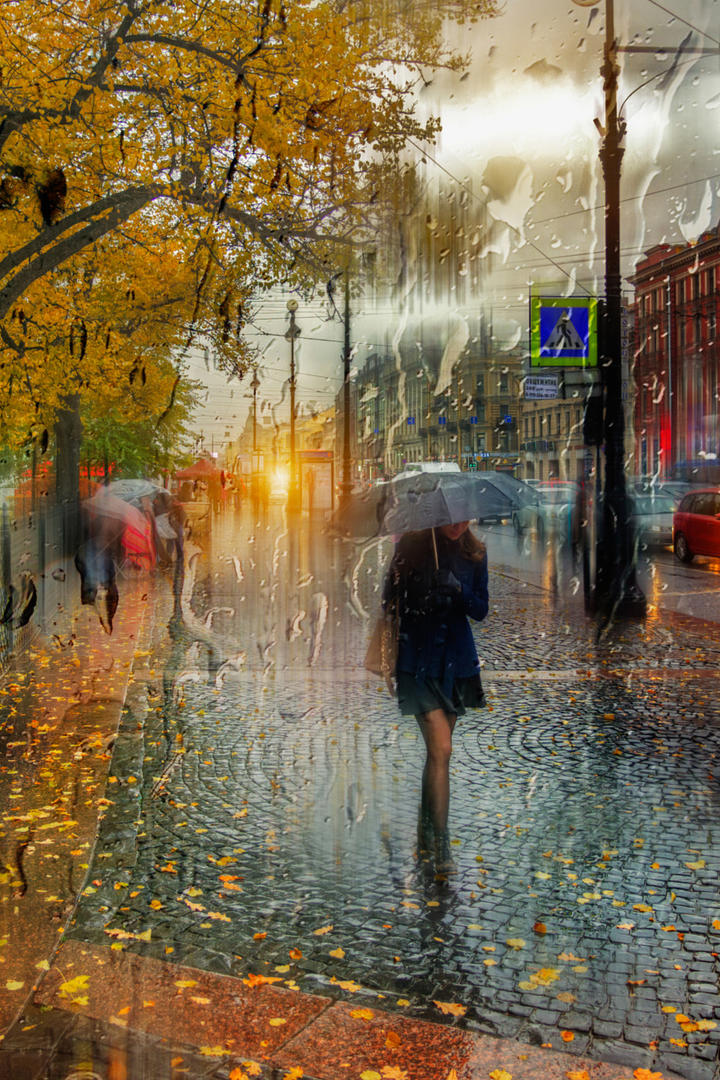 撑着伞走在雨中的美女艺术摄影图片